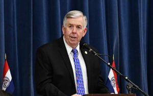 Governor Parson speaking at meeting.
