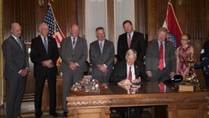 Governor Mike Parson signing Senate Bill 7.