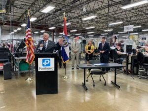 Governor Parson speaking in a manufacturing company.