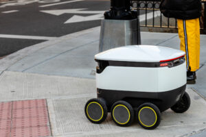 Autonomous food delivery vehicle on the street.