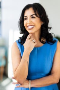 Headshot of Gabriela Ramirez-Arellano wearing blue sleeveless dress.