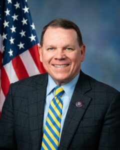 headshot of Congressman Graves wearing a suit and tie in front of US flag
