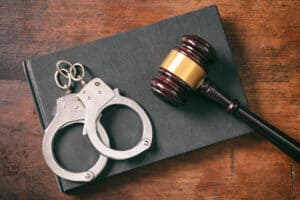 Handcuffs and gavel on a book