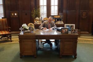 Gov. Kehoe signs bill at his desk
